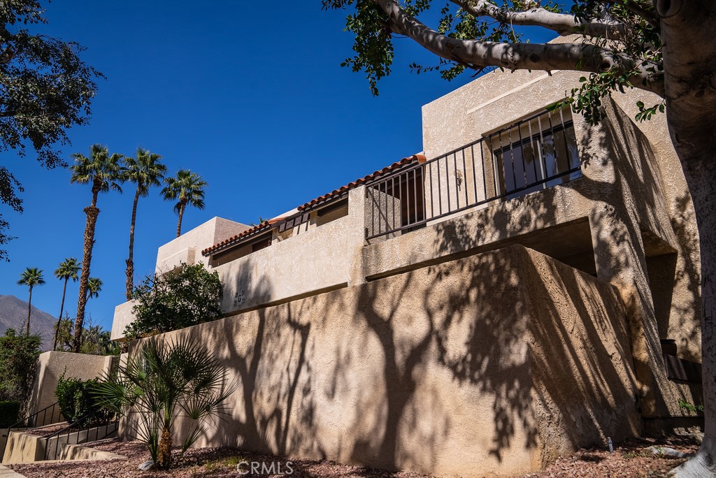 200 East Racquet Club Road, Unit 24 Palm Springs, CA 92262 - Photo 18 of 21 a view of a house with a street