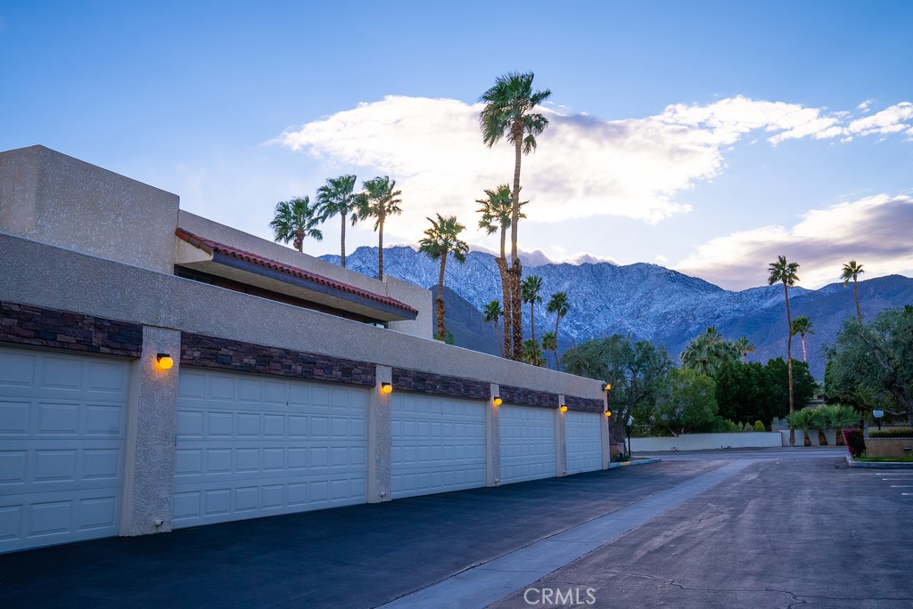 200 East Racquet Club Road, Unit 24 Palm Springs, CA 92262 - Photo 21 of 21 a view of a terrace with a yard