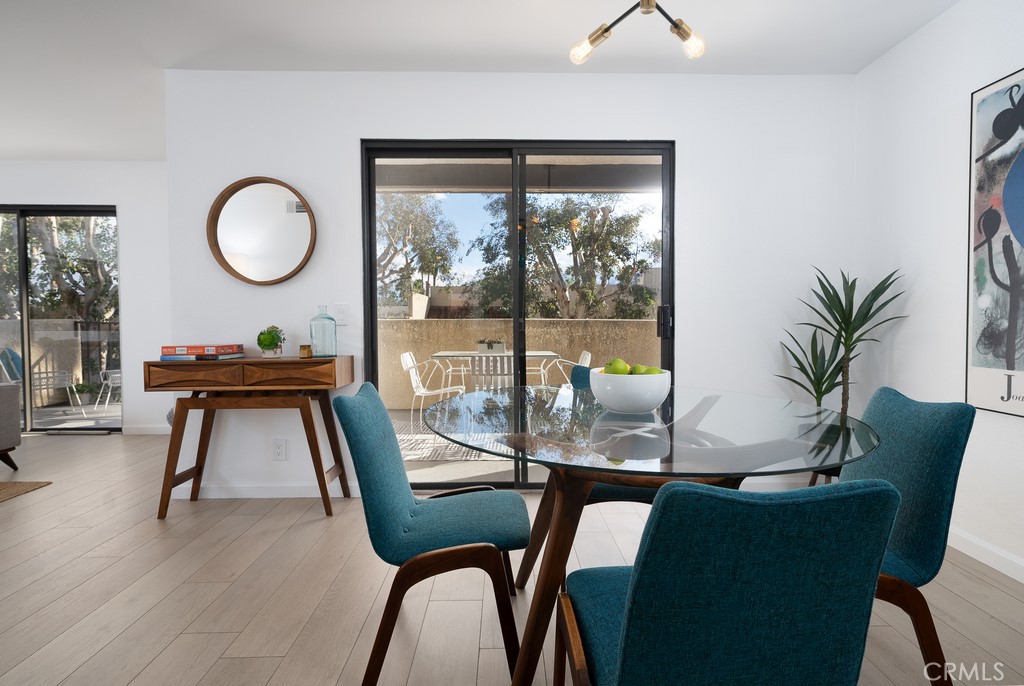 200 East Racquet Club Road, Unit 24 Palm Springs, CA 92262 - Photo 3 of 21 a living room with furniture and a potted plant