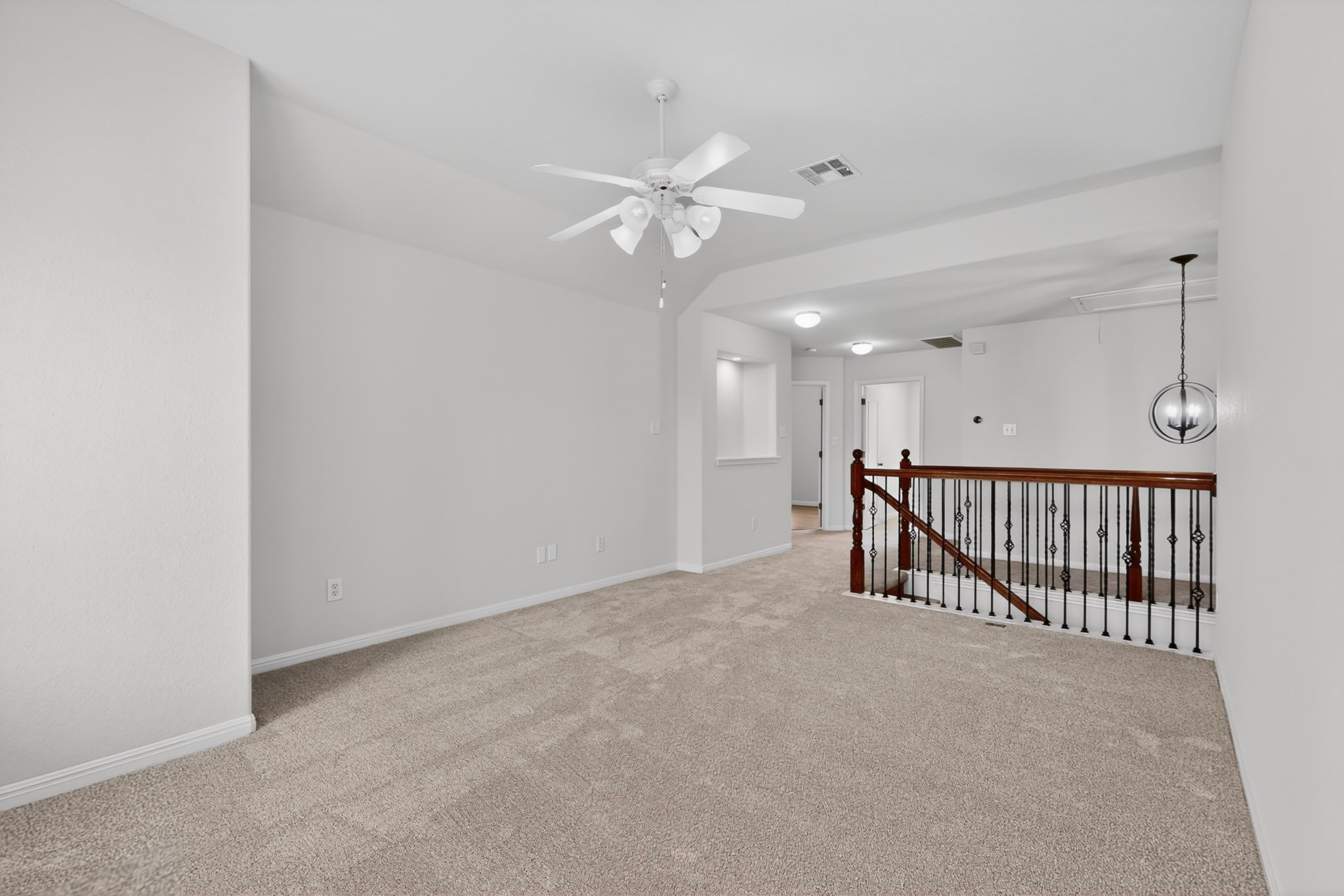 8617 Cobblestone Austin, TX 78735 - Photo 30 of 39 a view of a hallway with a ceiling fan