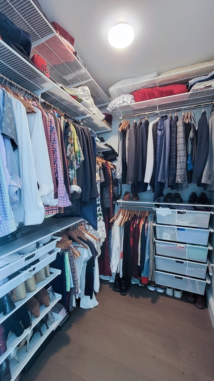 240 Devonshire Street, Unit 5514 Boston, MA 02110 - Photo 11 of 26 a view of walk in closet with clothes