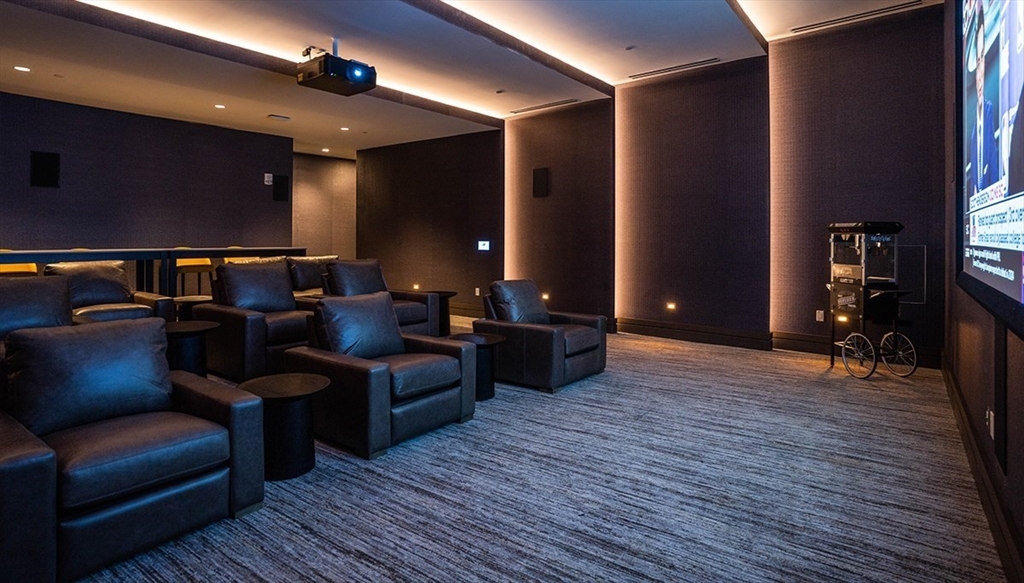 240 Devonshire Street, Unit 5514 Boston, MA 02110 - Photo 14 of 26 a living room with furniture and a wooden floor