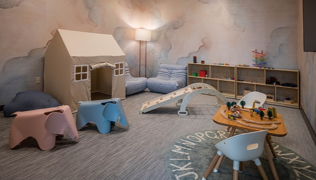 240 Devonshire Street, Unit 5514 Boston, MA 02110 - Photo 20 of 26 a room with furniture and a wooden floor