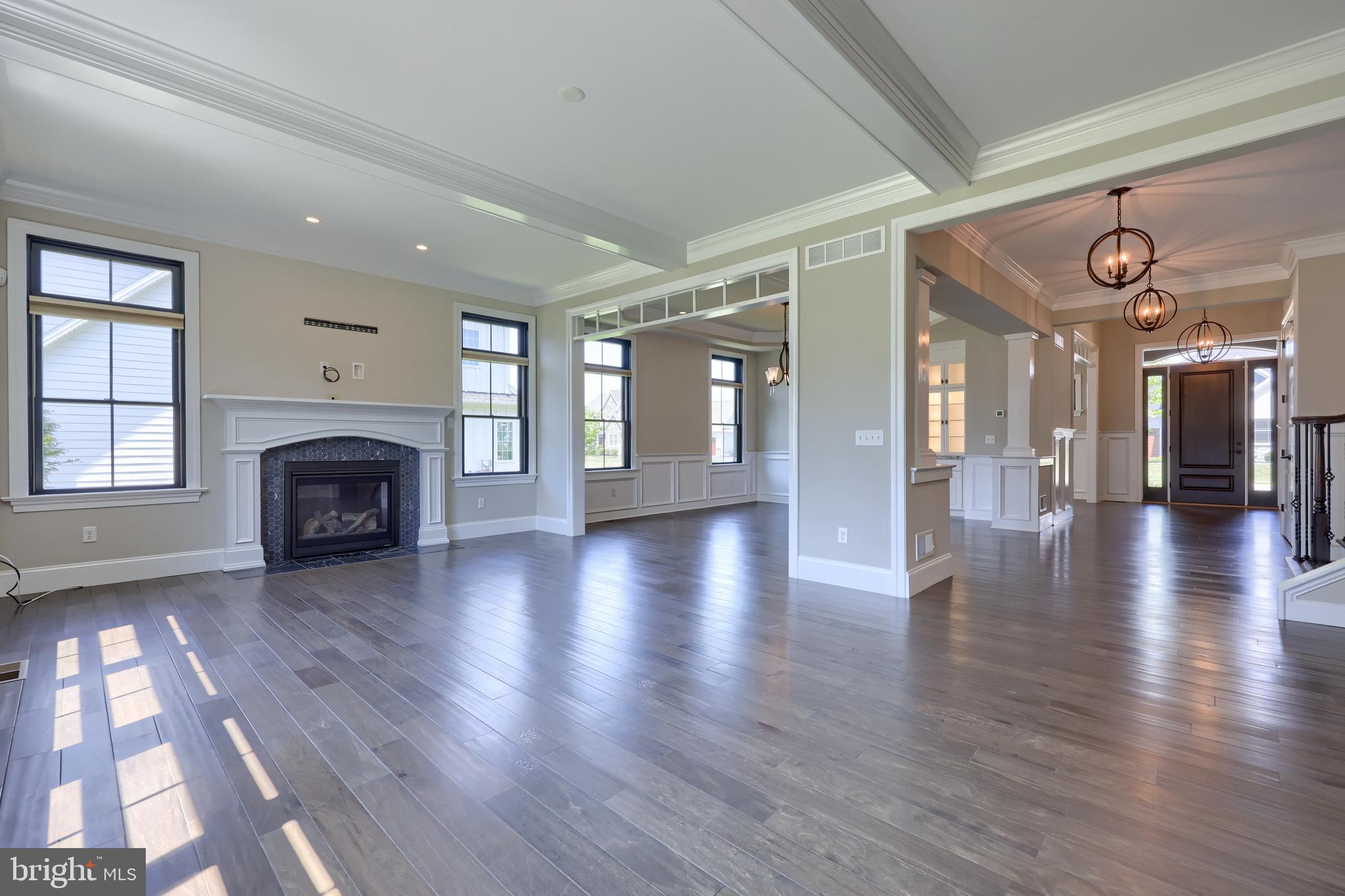 428 Southampton Drive Lititz, PA 17543 - Photo 19 of 60 a view of a livingroom with fireplace wooden floor and windows