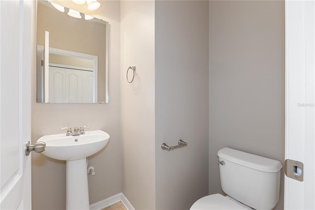 506 Rainbow Springs Loop Groveland, FL 34736 - Photo 21 of 30 a bathroom with a sink toilet