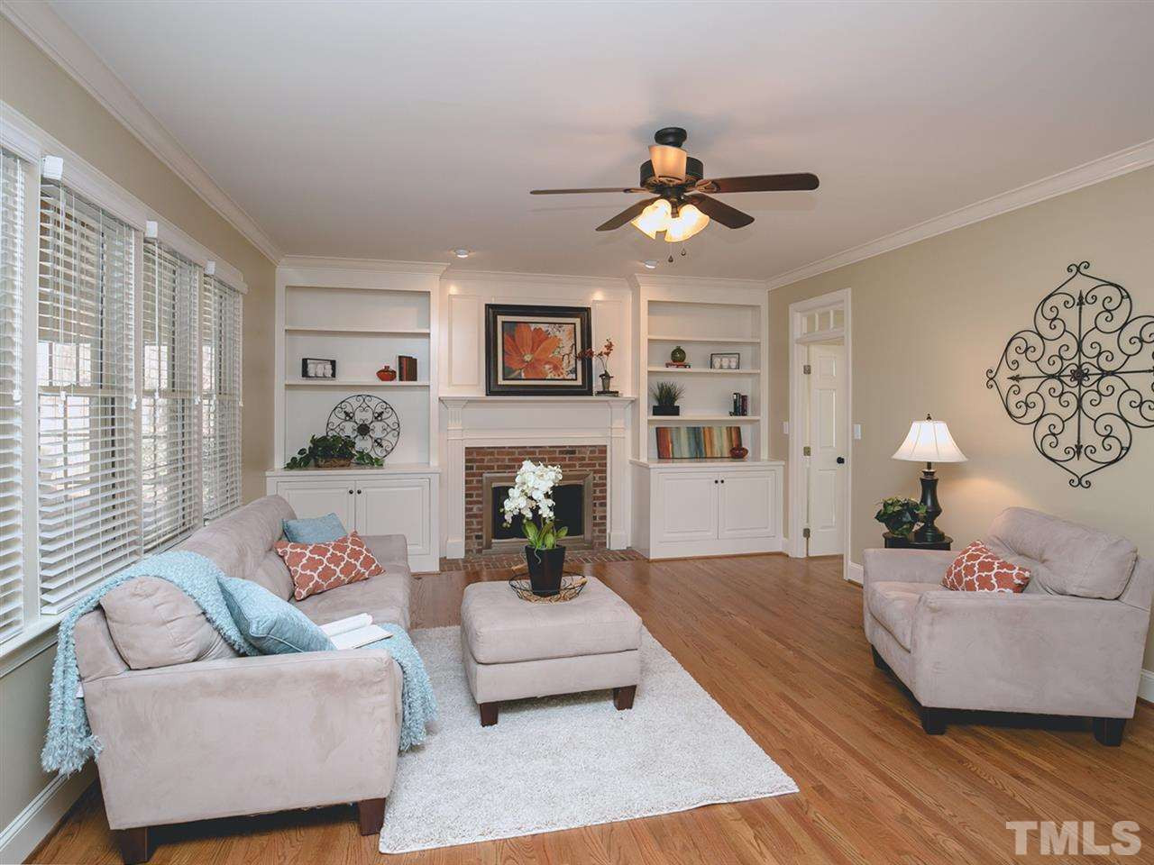 7909 Ridge Pointe Lane Raleigh, NC 27615 - Photo 6 of 25 Bookshelves flank the fireplace in this spacious family room