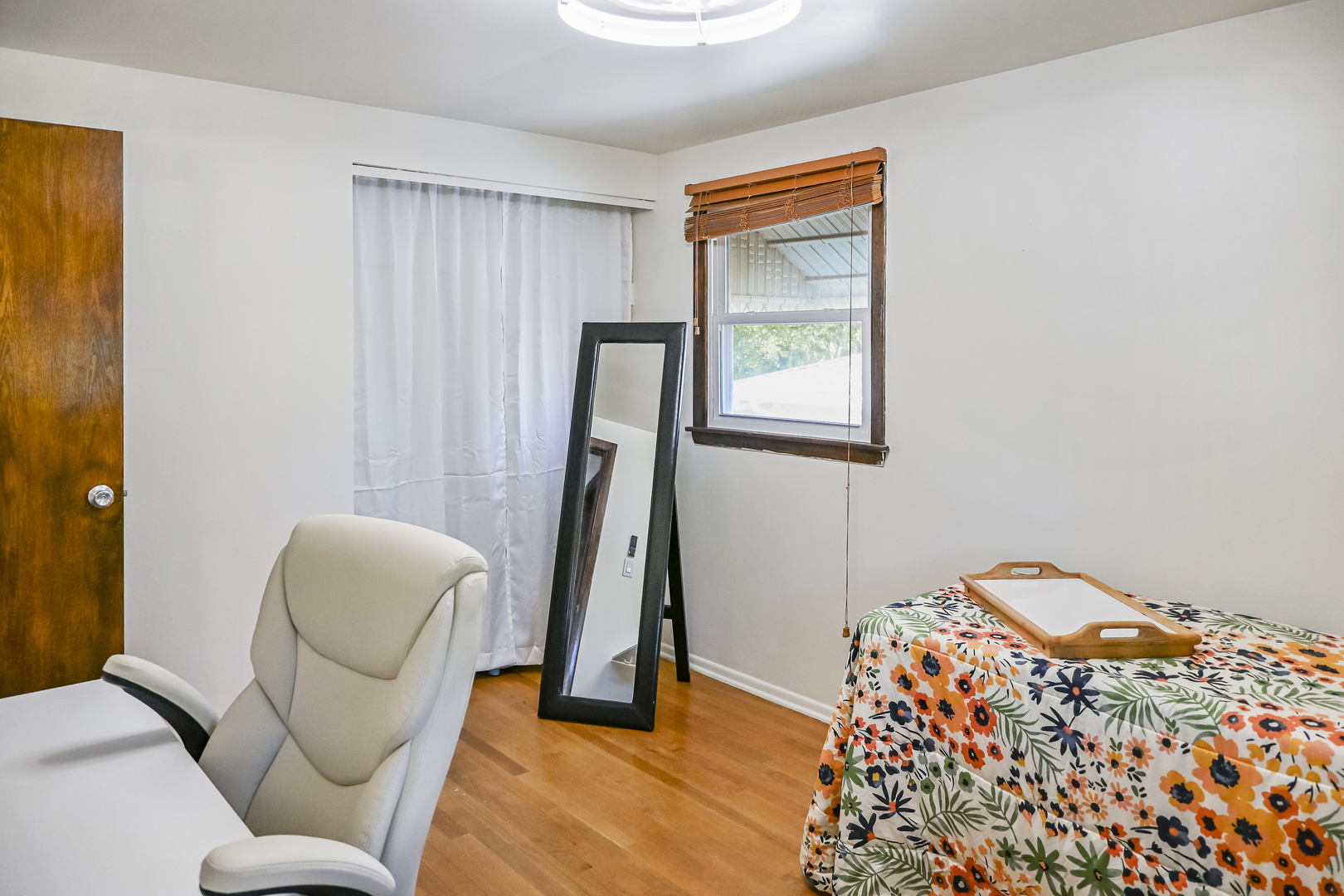 15115 Springfield Avenue Midlothian, IL 60445 - Photo 11 of 18 a bedroom with a bed and a chair