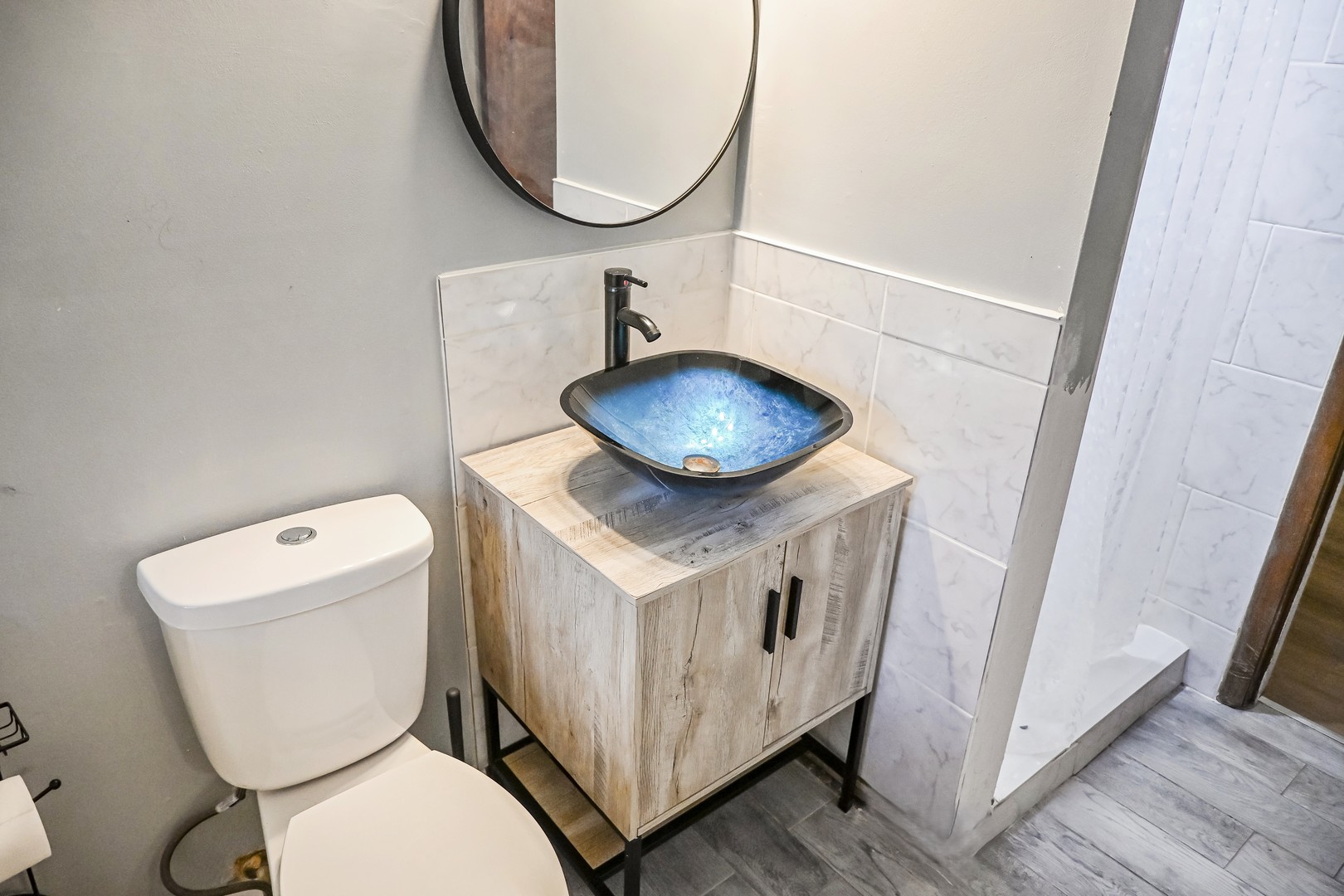 15115 Springfield Avenue Midlothian, IL 60445 - Photo 16 of 18 a bathroom with a toilet and a mirror