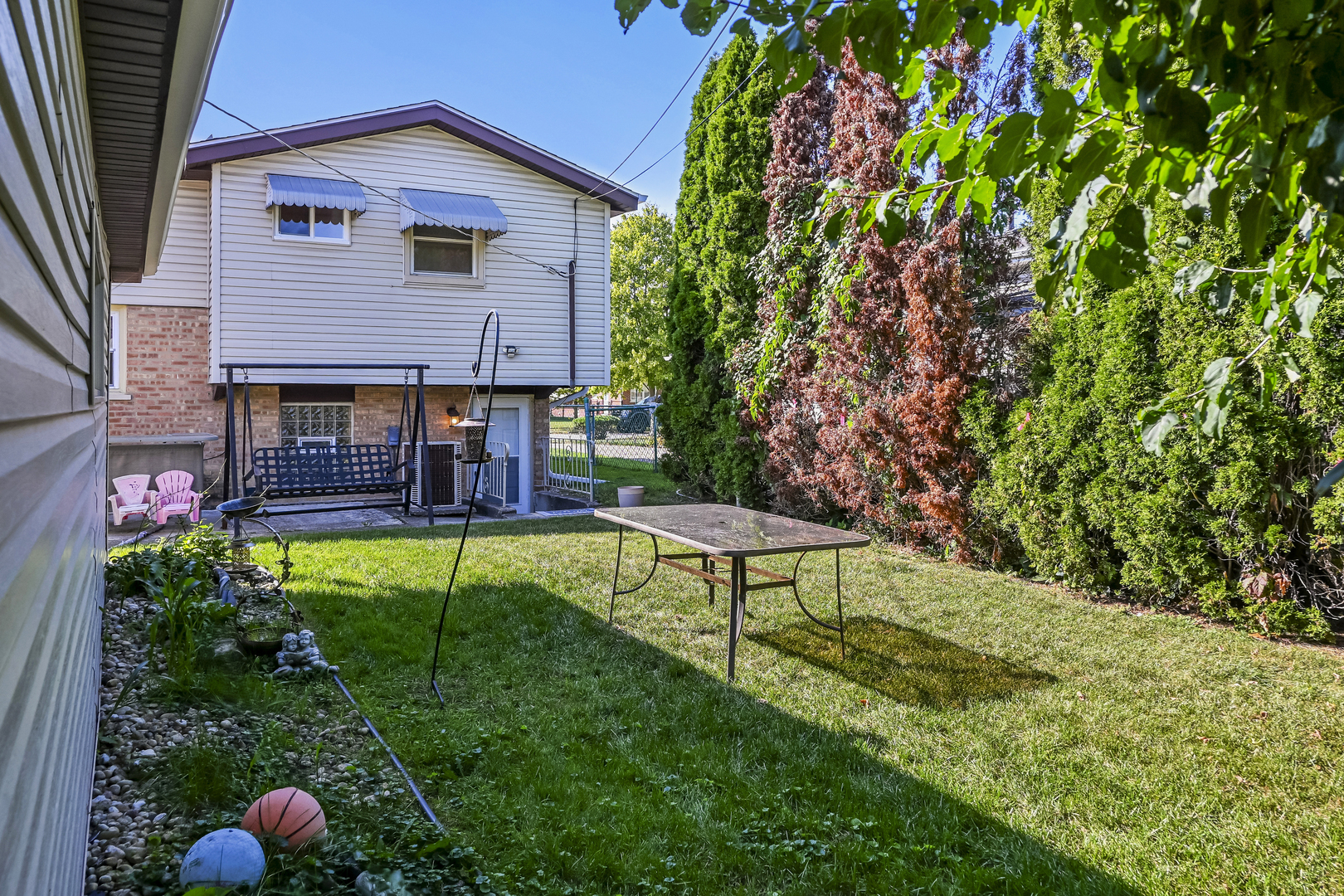 15115 Springfield Avenue Midlothian, IL 60445 - Photo 18 of 18 a front view of house with a garden and patio