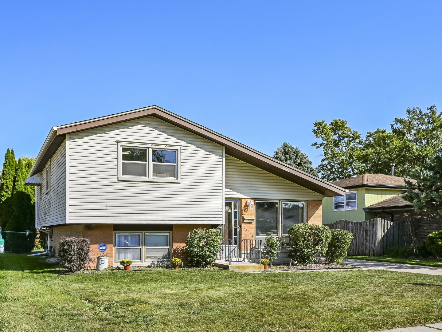15115 Springfield Avenue Midlothian, IL 60445 - Photo 2 of 18 a front view of house with yard and green space
