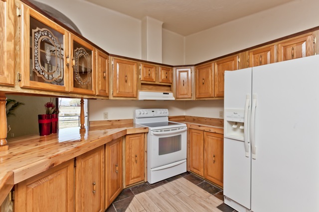 890-20 20 1/2 Road Fruita, CO 81521 - Photo 14 of 37 a kitchen with stainless steel appliances granite countertop a refrigerator and a stove top oven