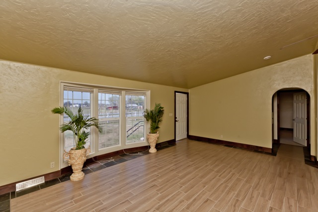 890-20 20 1/2 Road Fruita, CO 81521 - Photo 3 of 37 a view of a room with wooden floor and a potted plant