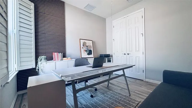 a view of a workspace with furniture