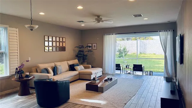 a living room with furniture and a large window