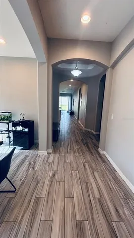 a view of a living room with wooden floor