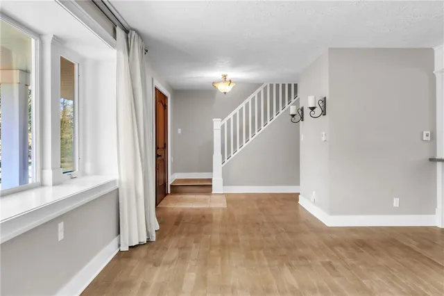 a view of entryway with wooden floor