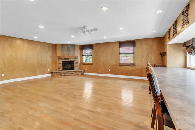 a view of a kitchen with a sink and a refrigerator