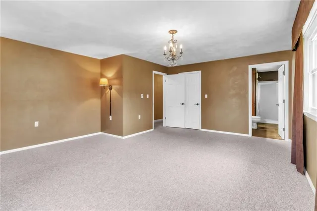 a view of a chandelier and a chandelier in big room
