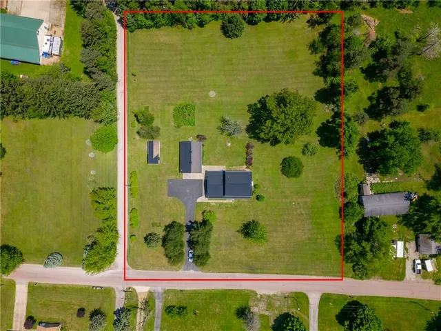 a view of a swimming pool with an outdoor space and seating area