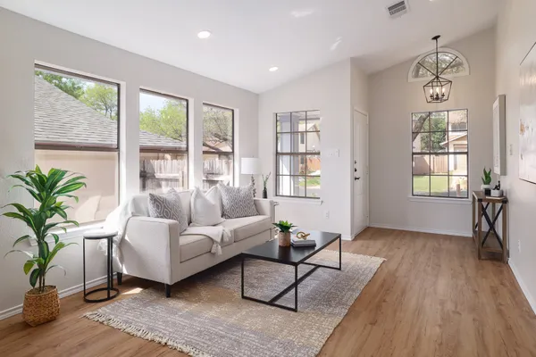 a living room with furniture and a window