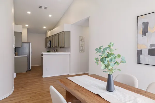 a view of kitchen with cabinets and wooden floor