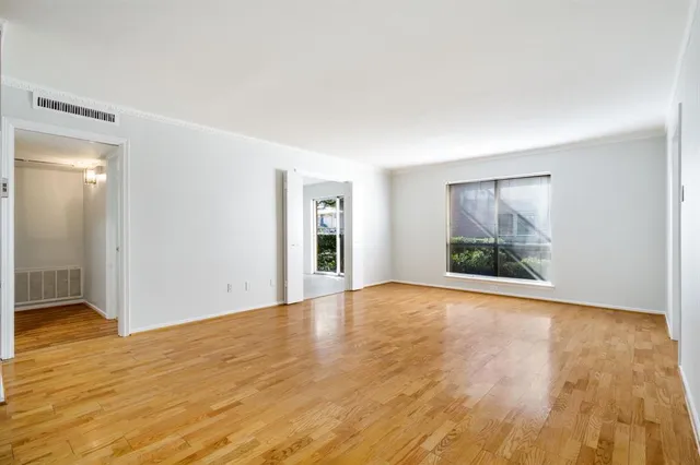 a kitchen with a sink a counter top space and cabinets
