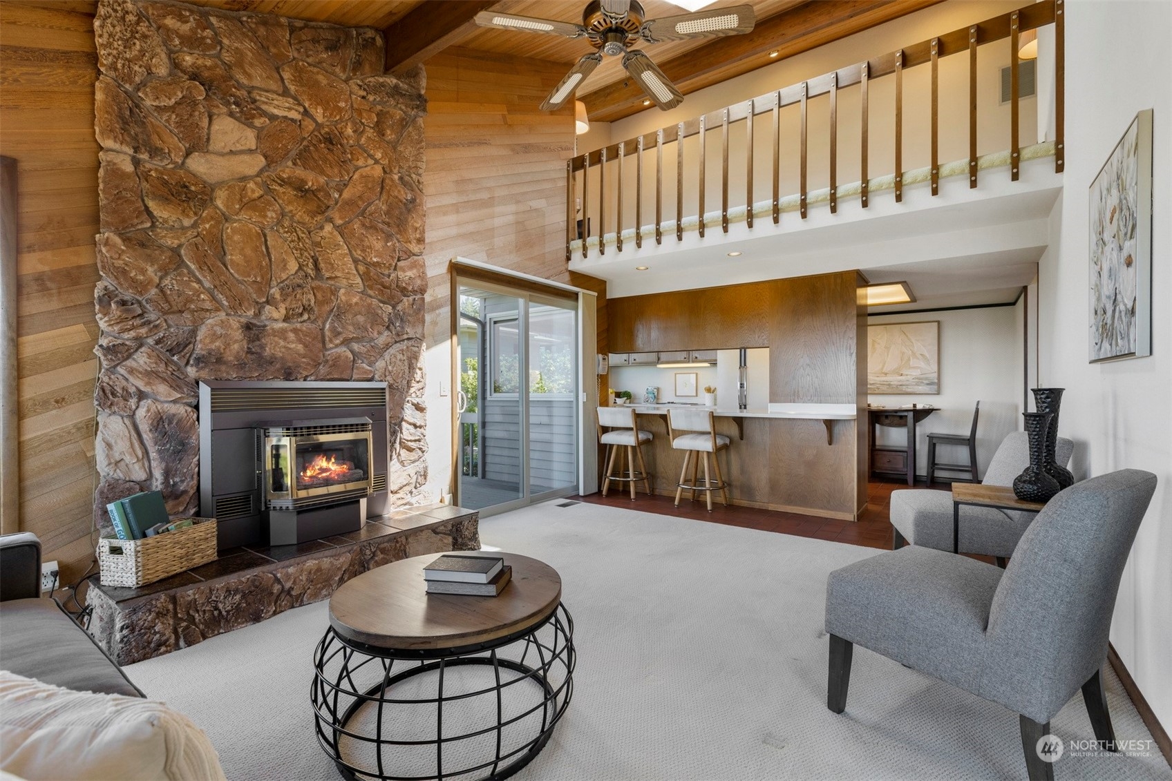 623 Briar Road Bellingham, WA 98225 - Photo 16 of 40 a living room with furniture a fireplace and a table