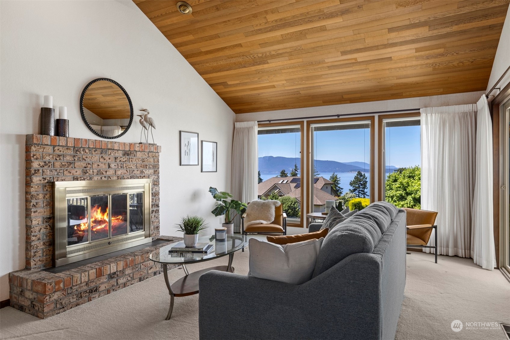 623 Briar Road Bellingham, WA 98225 - Photo 19 of 40 a living room with furniture a fireplace and a large window
