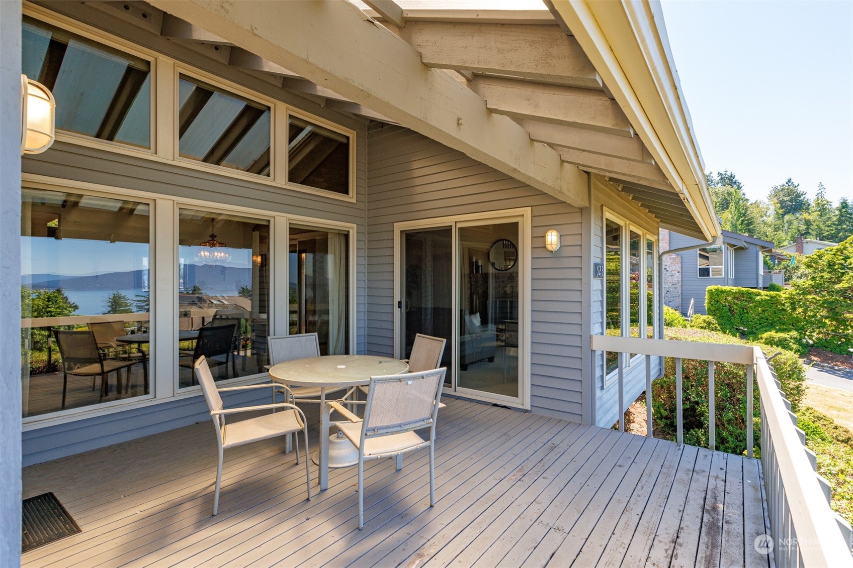 623 Briar Road Bellingham, WA 98225 - Photo 35 of 40 a view of a house with a chairs and table in a patio