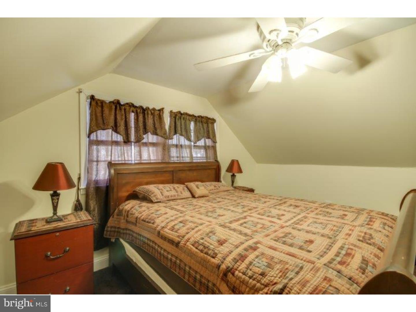 206 Swarthmore Road Glassboro, NJ 08028 - Photo 18 of 24 a bedroom with a bed and a chandelier