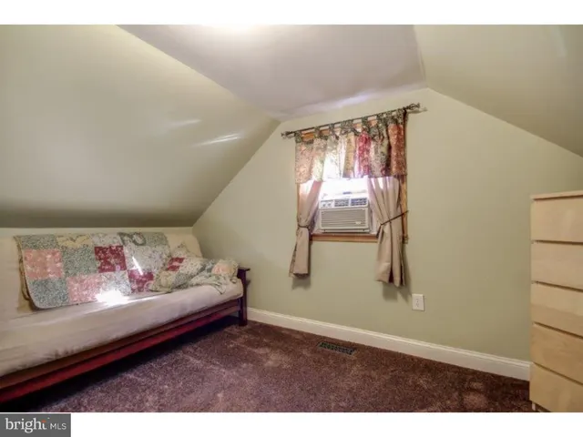 a view of livingroom with furniture and toys