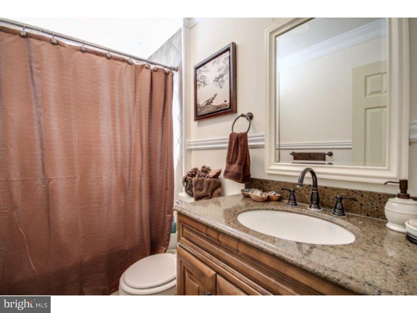 206 Swarthmore Road Glassboro, NJ 08028 - Photo 20 of 24 a bathroom with a granite countertop sink and a mirror