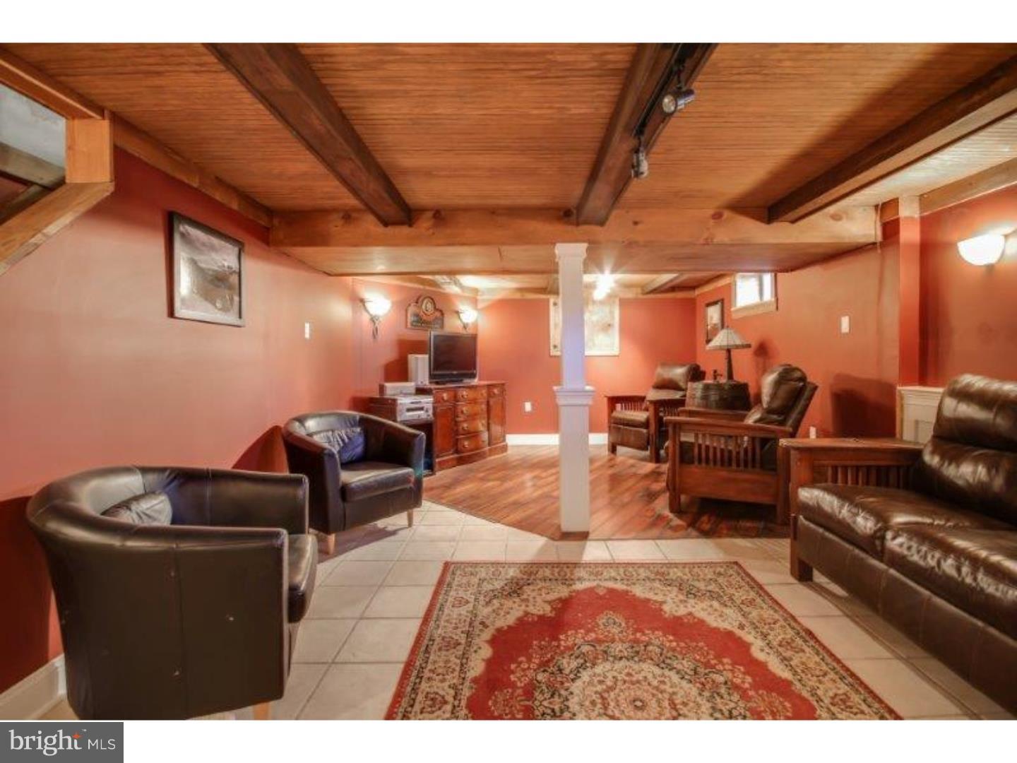 206 Swarthmore Road Glassboro, NJ 08028 - Photo 22 of 24 a living room with furniture and a wooden floor