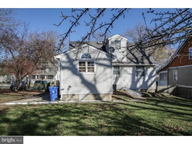 a aerial view of a house with a yard