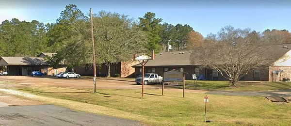 a view of a trees in front of a building