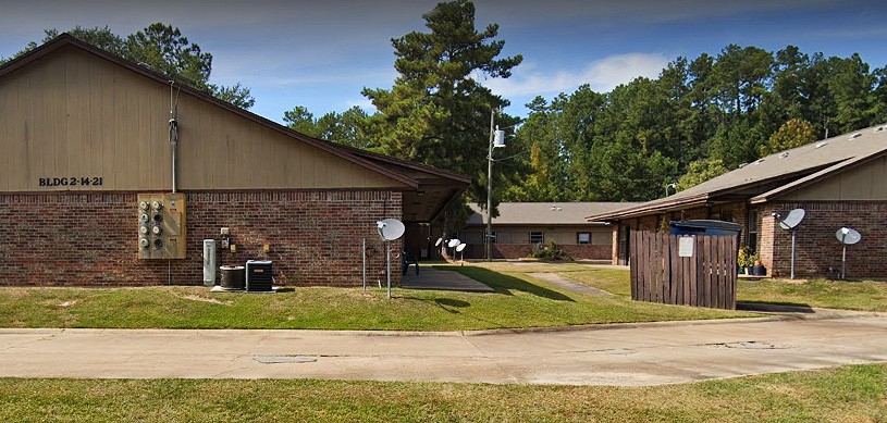 8396 Kurthwood Road Leesville, LA 71446 - Photo 4 of 7 a view of a house with a yard and plants