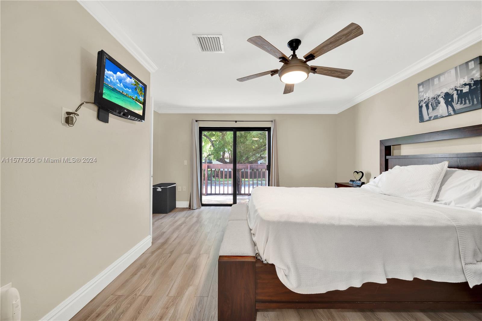 13339 Southwest 112th Terrace, Unit 504 Miami, FL 33186 - Photo 14 of 26 a bed room with a bed and a window