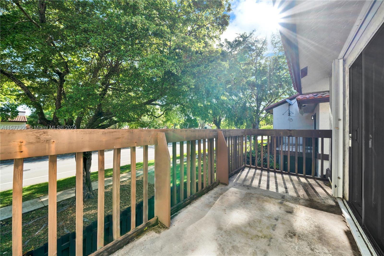 13339 Southwest 112th Terrace, Unit 504 Miami, FL 33186 - Photo 17 of 26 a view of a wooden fence