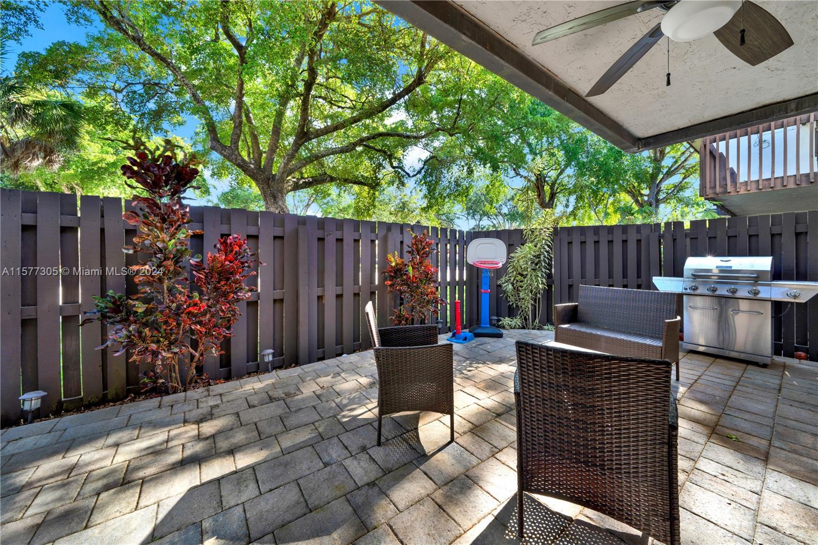 13339 Southwest 112th Terrace, Unit 504 Miami, FL 33186 - Photo 20 of 26 a view of a chairs and table in the patio