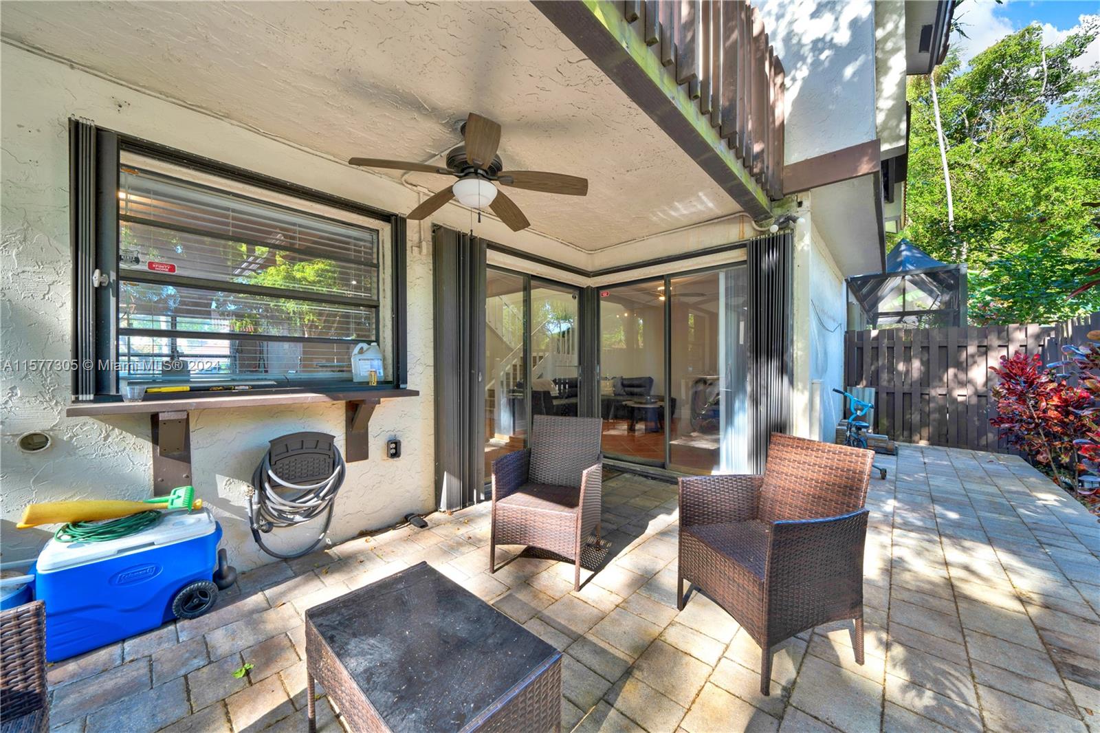 13339 Southwest 112th Terrace, Unit 504 Miami, FL 33186 - Photo 21 of 26 a living room with furniture and a potted plant