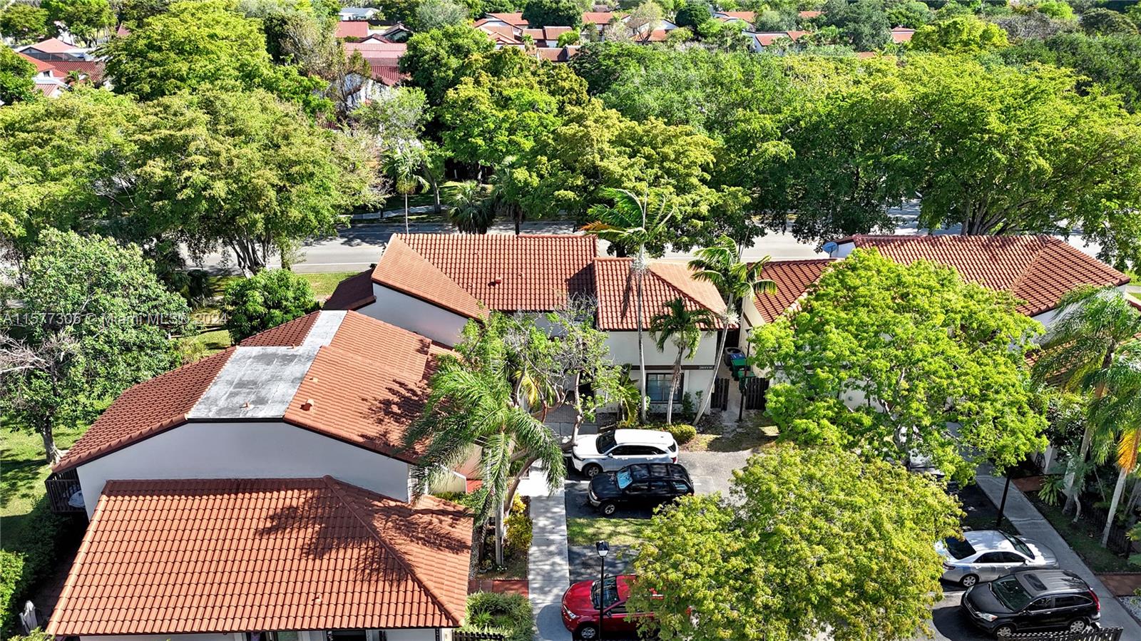 13339 Southwest 112th Terrace, Unit 504 Miami, FL 33186 - Photo 25 of 26 an aerial view of a house with a yard