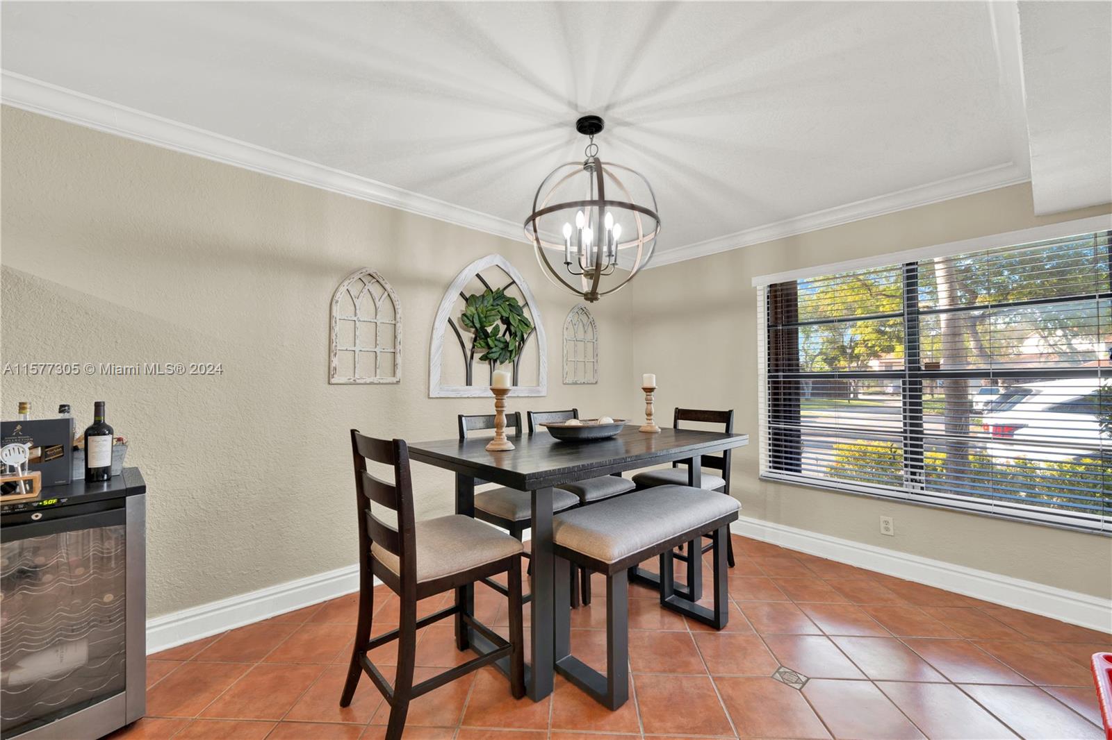 13339 Southwest 112th Terrace, Unit 504 Miami, FL 33186 - Photo 8 of 26 a view of a dining room with furniture wooden floor and chandelier