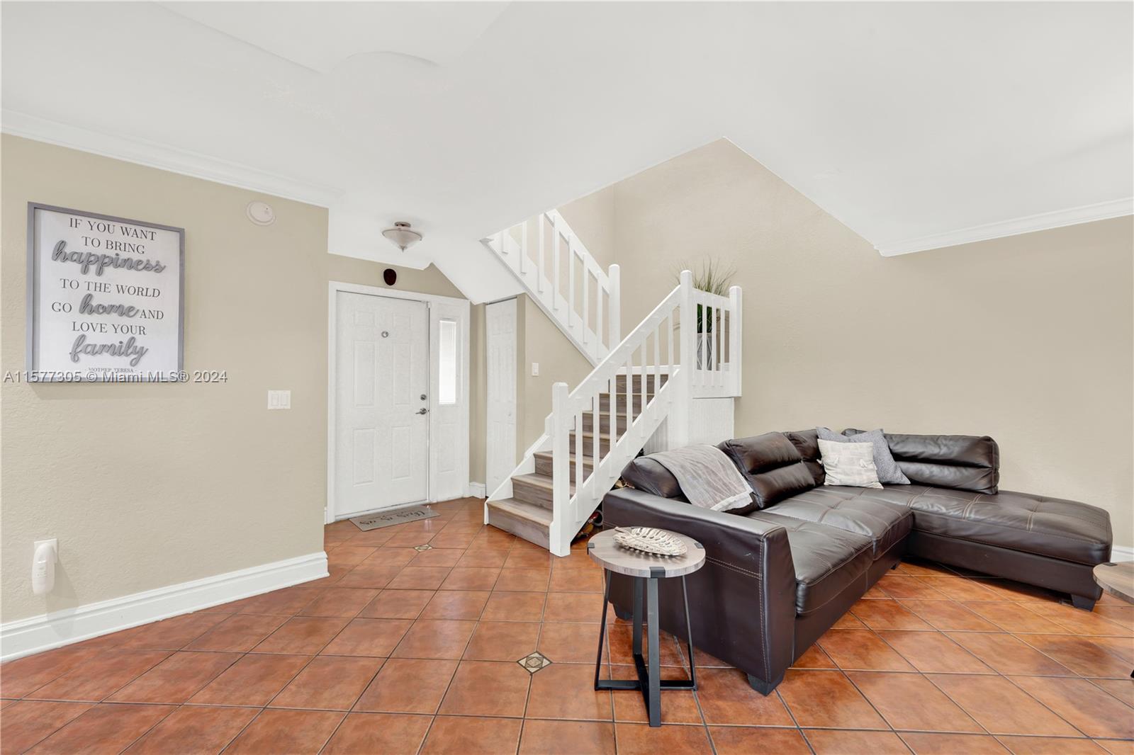 13339 Southwest 112th Terrace, Unit 504 Miami, FL 33186 - Photo 9 of 26 a living room with furniture and wooden floor