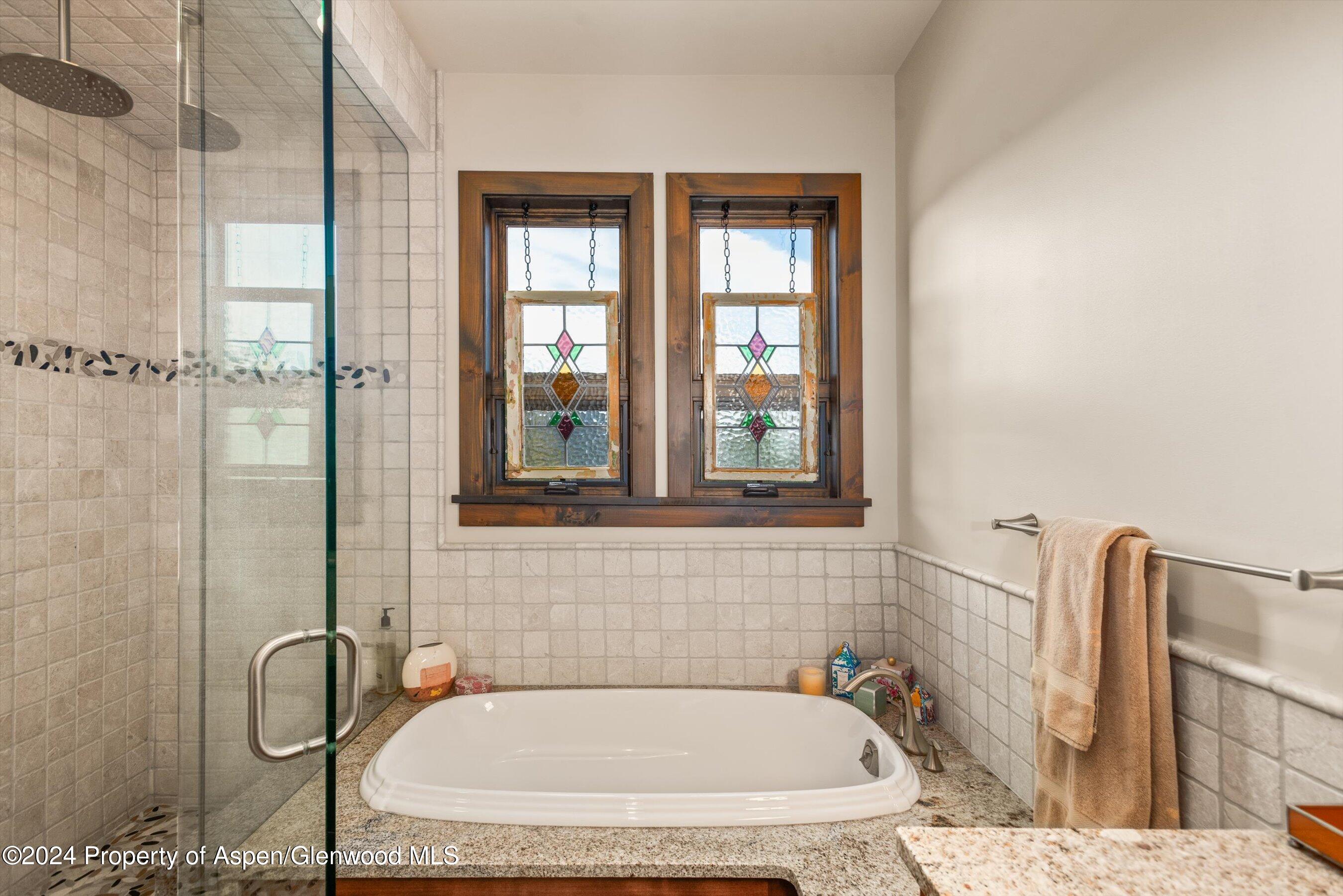 342 Sopris Circle Basalt, CO 81621 - Photo 11 of 34 a bathroom with a bath tub and a shower