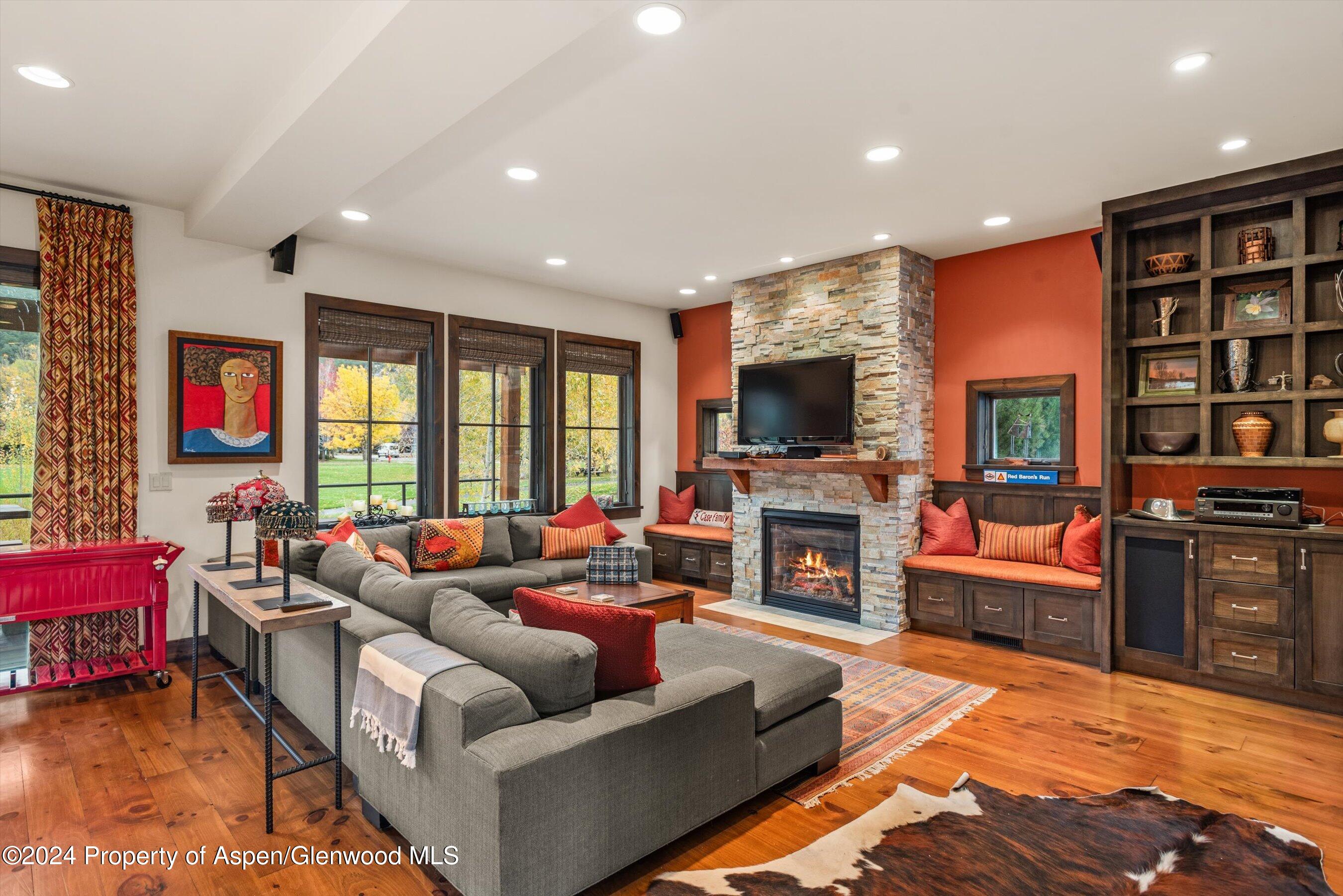 342 Sopris Circle Basalt, CO 81621 - Photo 16 of 34 a living room with fireplace furniture and a flat screen tv