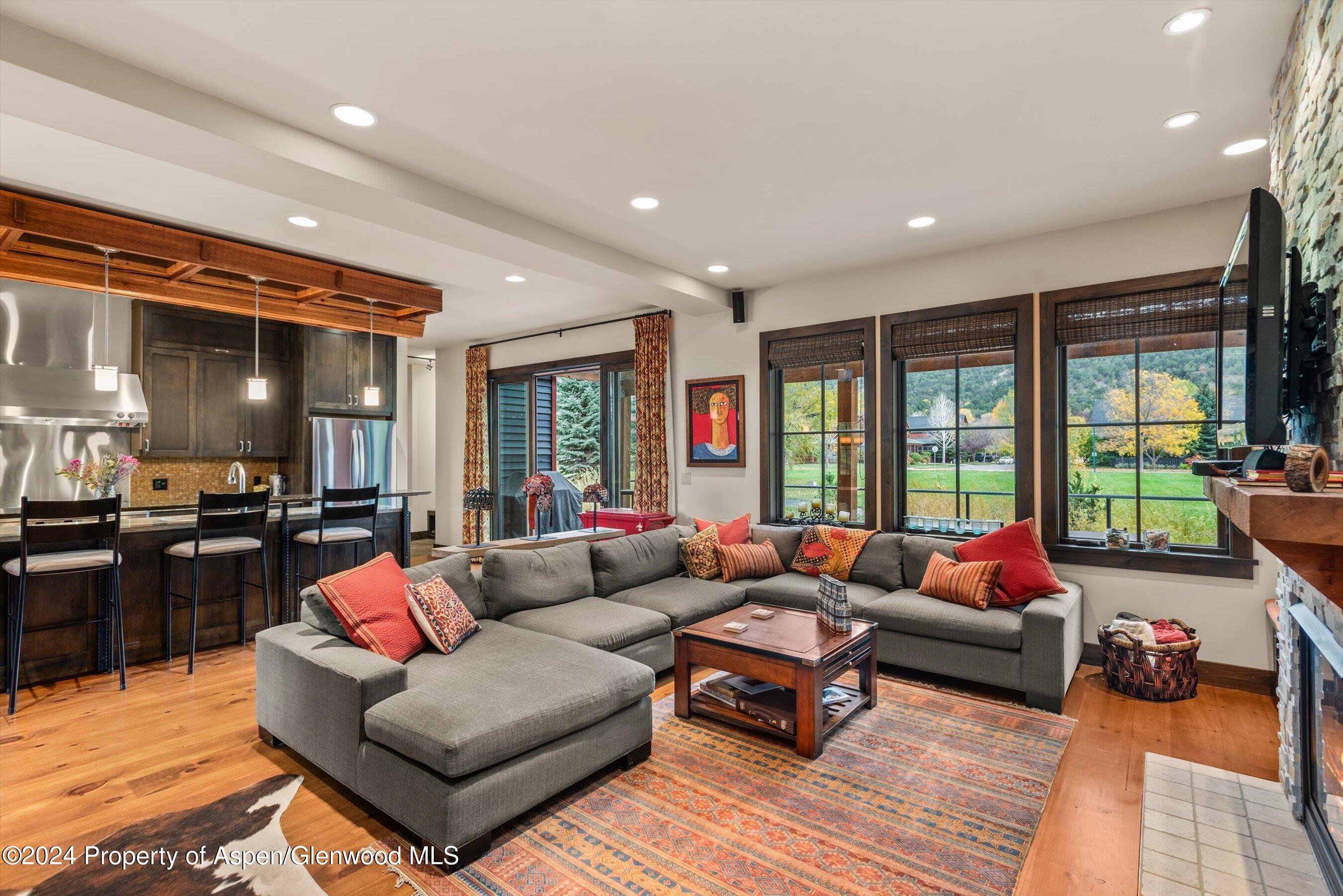 342 Sopris Circle Basalt, CO 81621 - Photo 18 of 34 a living room with furniture and large windows