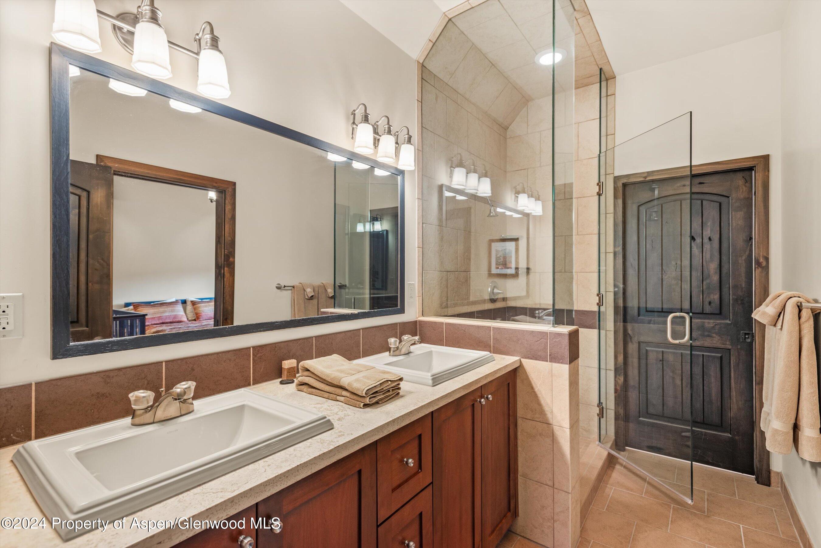 342 Sopris Circle Basalt, CO 81621 - Photo 27 of 34 a bathroom with a sink double vanity and a mirror