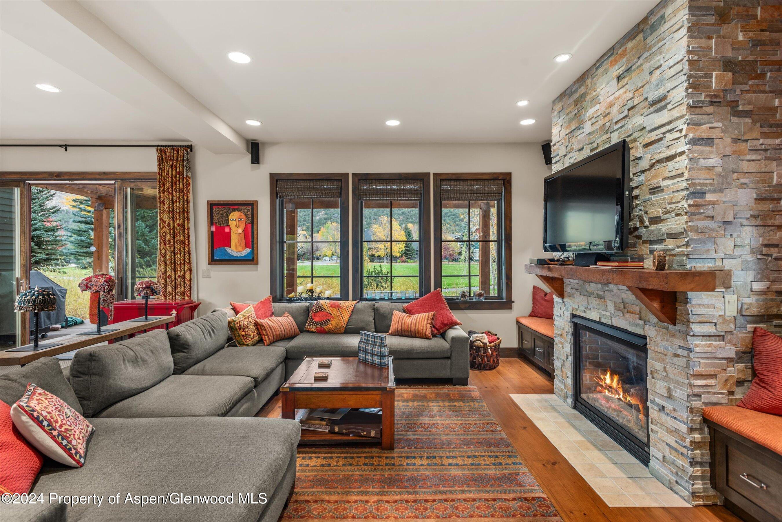 342 Sopris Circle Basalt, CO 81621 - Photo 3 of 34 a living room with furniture and a fireplace
