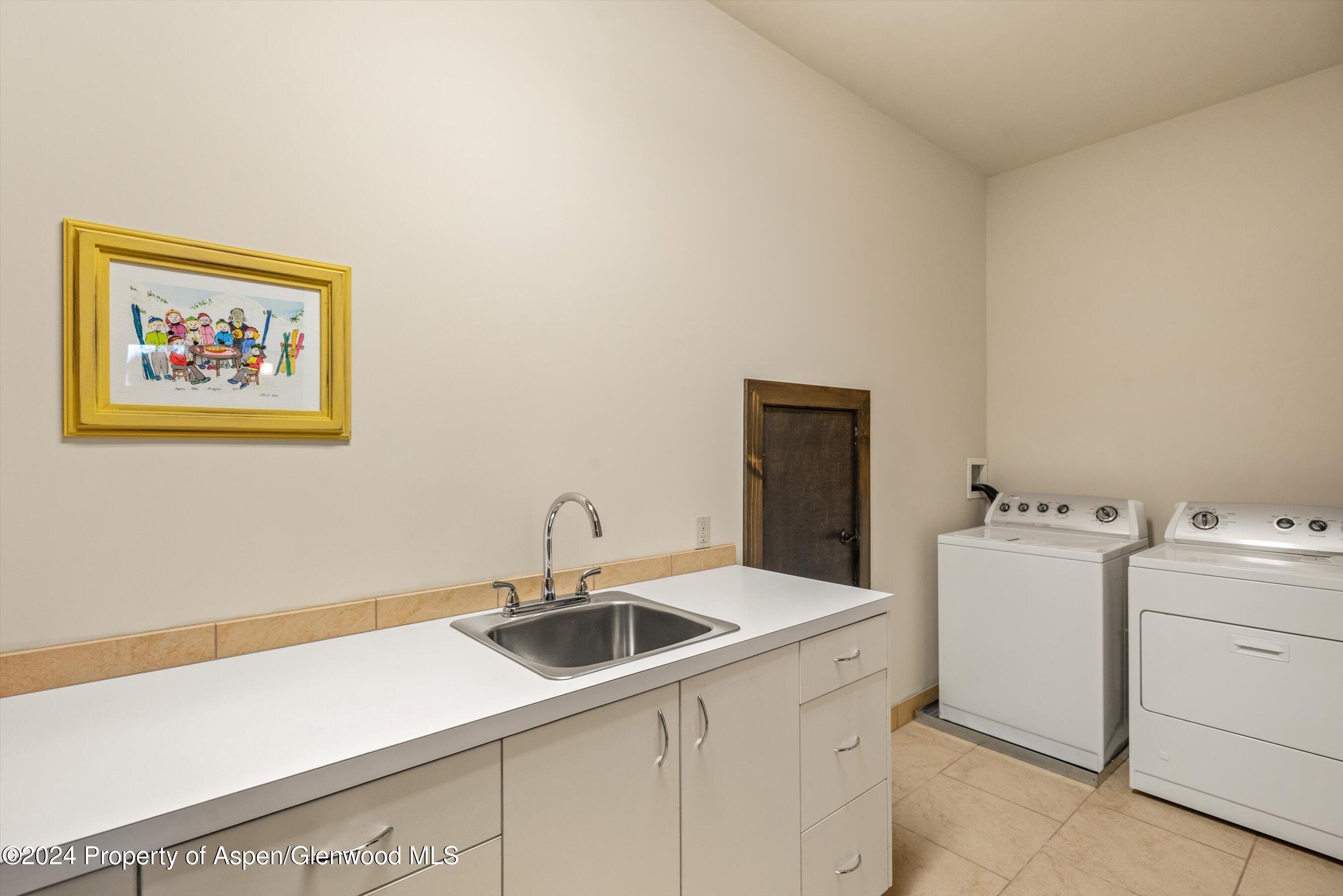342 Sopris Circle Basalt, CO 81621 - Photo 34 of 34 a utility room with dryer and washer