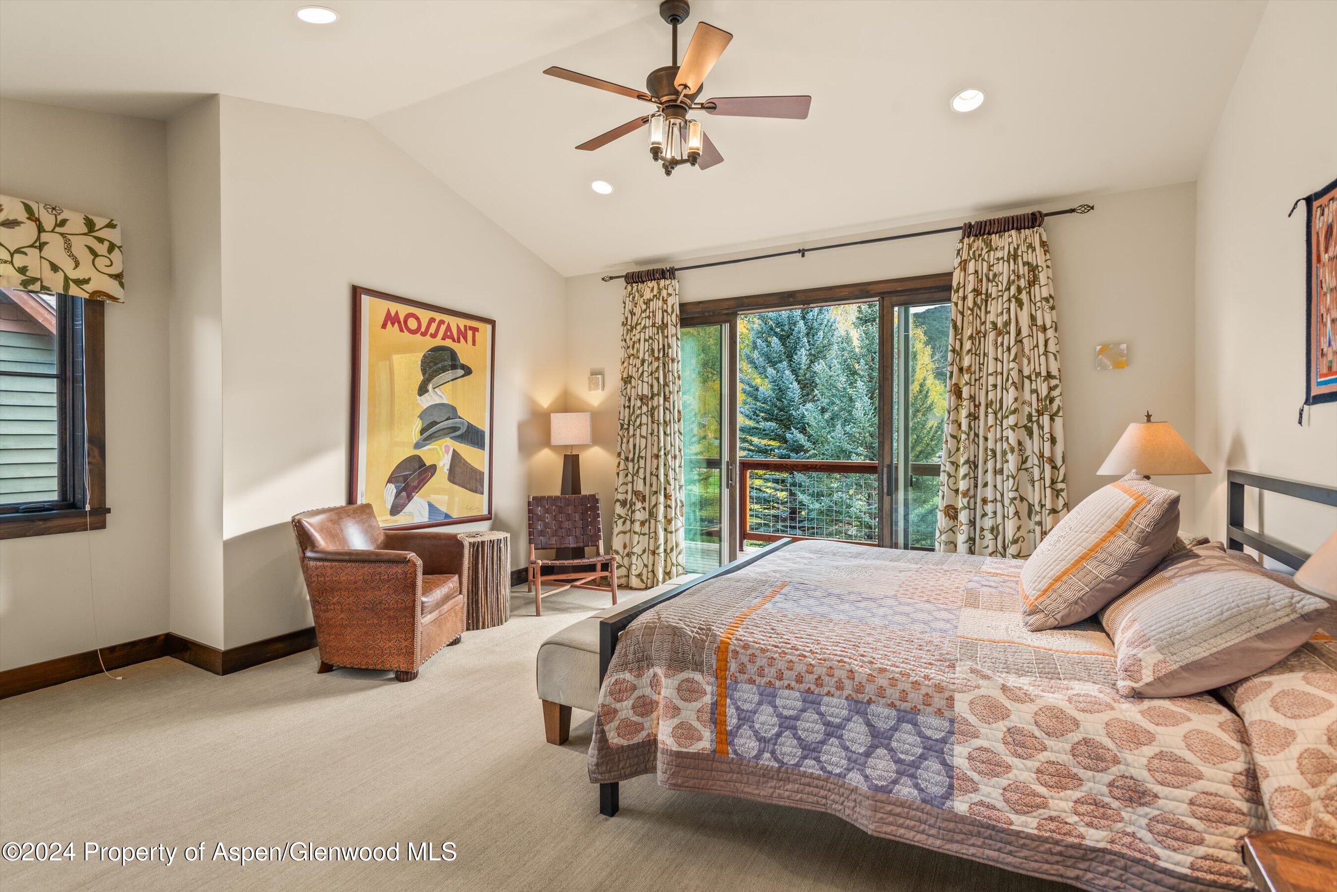 342 Sopris Circle Basalt, CO 81621 - Photo 9 of 34 a bedroom with a bed couch and window
